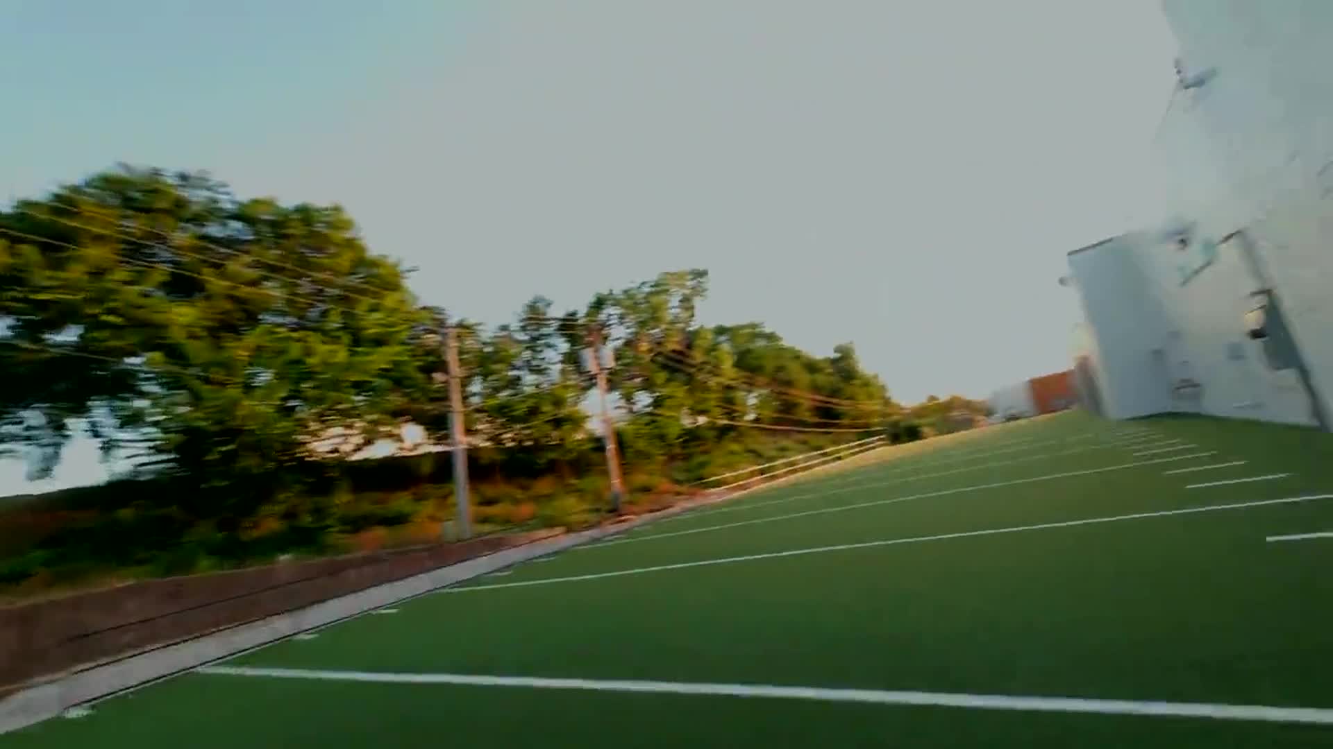 The outside wall of Westwood Fitness along the edge of the turf field