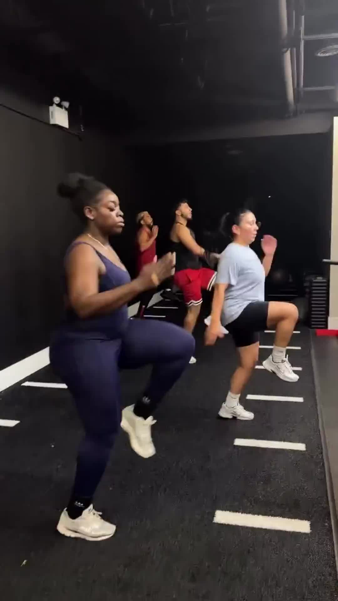 Members performing high knees during mixed Power House group training