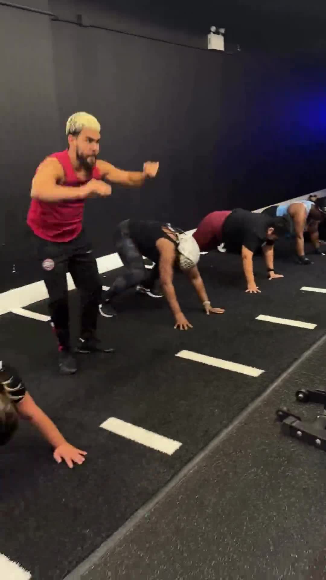 Members doing bodyweight conditioning during mixed Power House group training