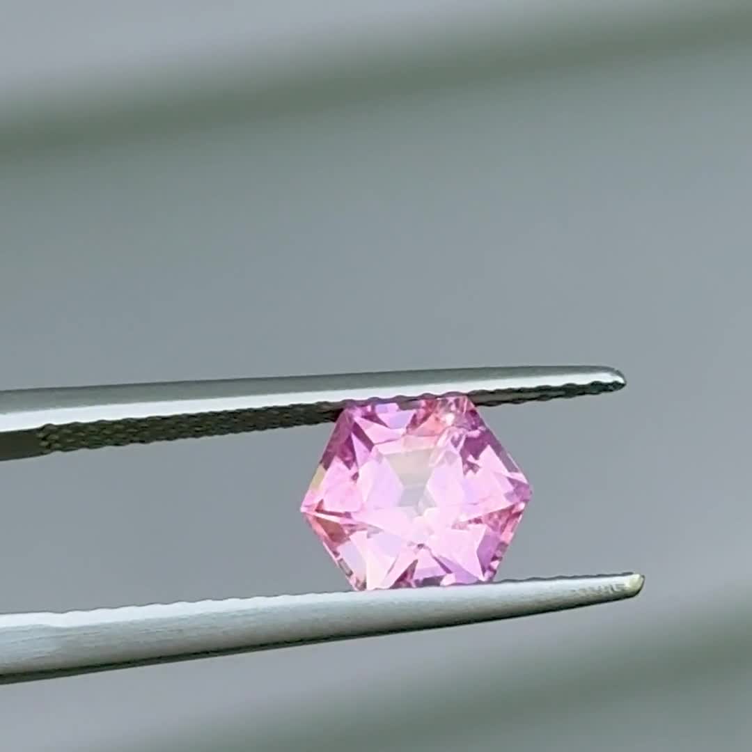 A vibrant Barbie pink hexagonal sapphire, from Jane Taylor's gem