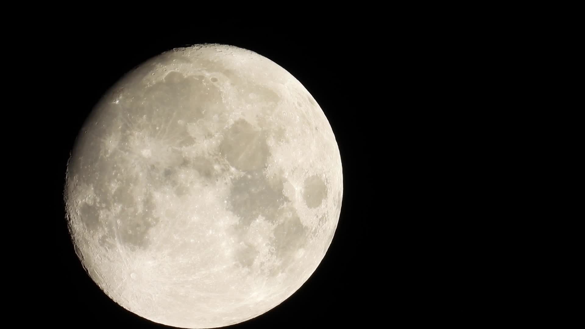 The full moon against a black sky