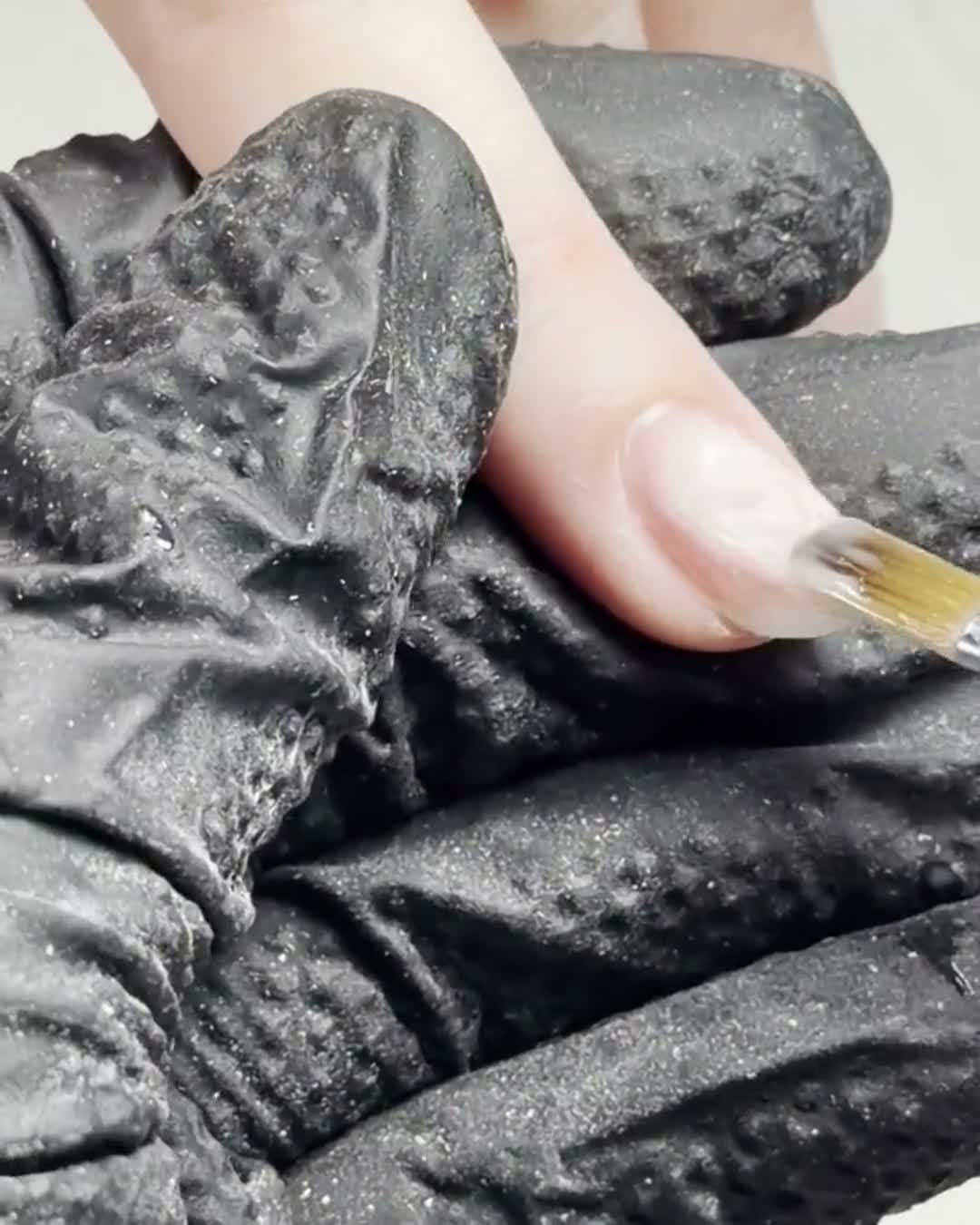 Gel being applied with a fine brush