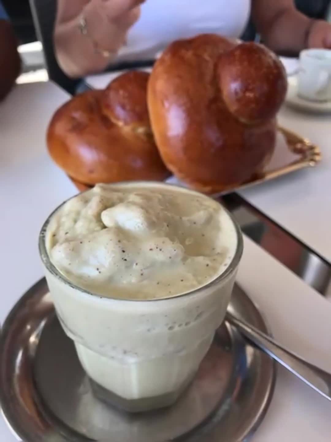 Coffee and brioche at a café