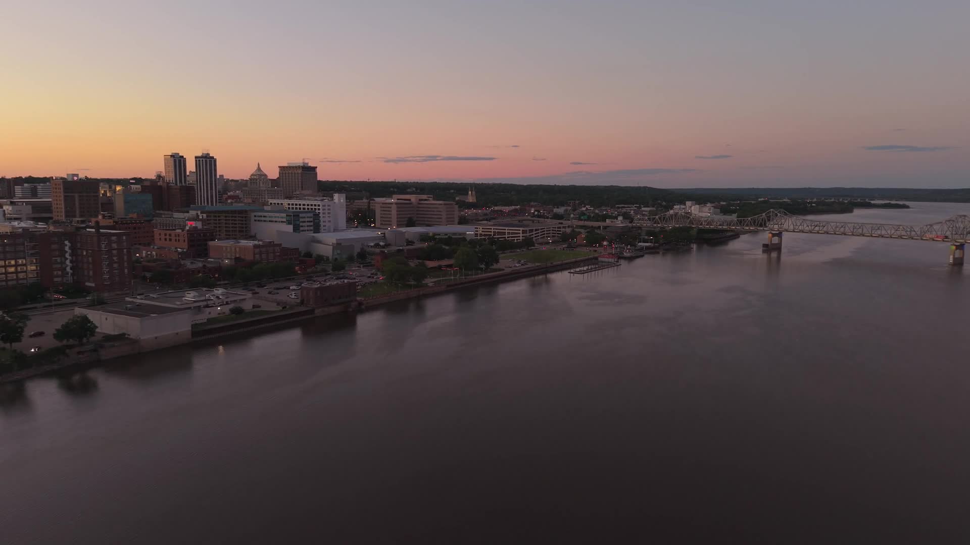 Aerial frame of the river and city skyline in central Illinois at golden hour