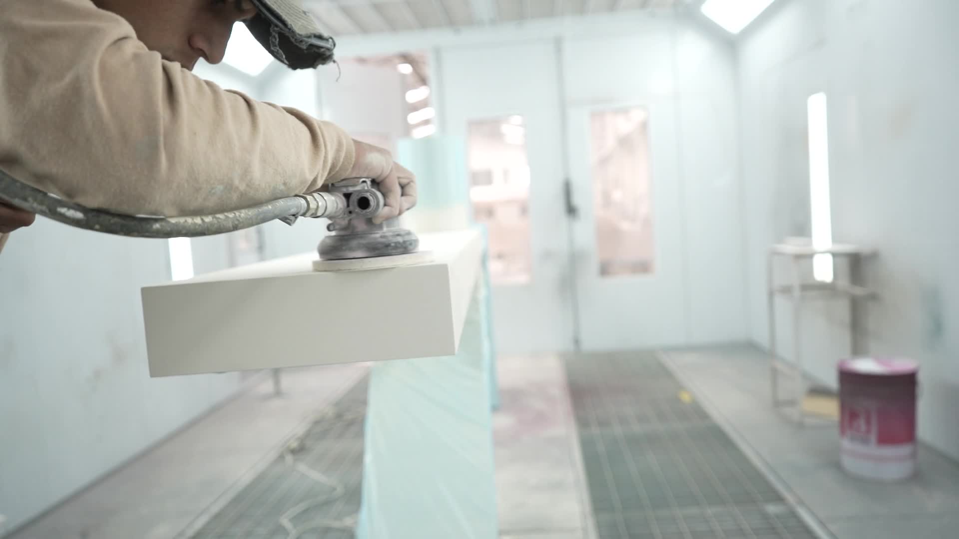 A maker carefully finishing a surface in the Casa Materia workshop
